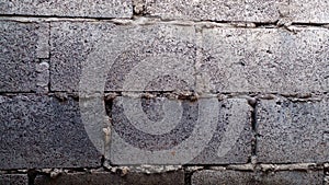 Concrete brick wall as background. The old concrete brick walls are still solid.