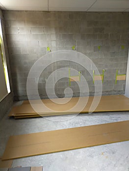 Concrete brick wall MDF flooring panels fitout preparation photo