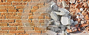 Concrete and brick wall rubble debris on construction site after a demolition of a brick building - image with copy space