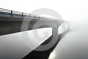 Concrete bridge in the middle of a deep fog
