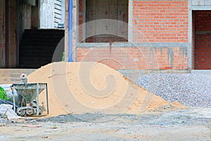 Concrete bucket mixer container cement and sand construction in building site workplace with copy space add text