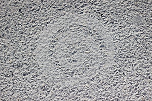 Concrete coating with impregnations of small stones texture