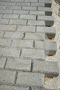 Concrete cobblestones pavement under construction