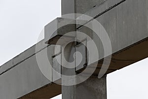 Concrete cross beams are connected to concrete columns for a factory building