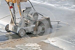 Concrete cutting machine at work