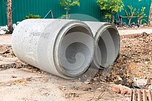 Concrete Drainage Pipe on a Construction Site.  Concrete drainage pipes stacked for construction. Concrete drainage tube on constr