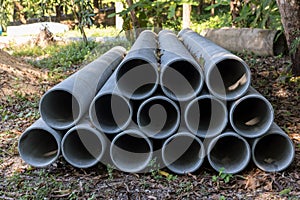 Concrete Drainage Pipe on a Construction Site.  Concrete drainage pipes stacked for construction. Concrete drainage tube on constr