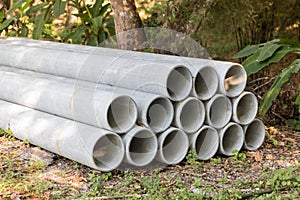 Concrete Drainage Pipe on a Construction Site.  Concrete drainage pipes stacked for construction. Concrete drainage tube on constr