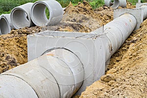 Concrete drainage pipe and manhole under construction