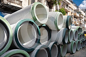 Concrete drainage pipes stacked on the street in Tel Aviv