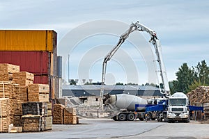 Concrete equipment works out of the port warehouse area.