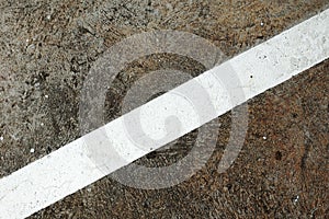 Concrete floor with white crosswise line photo