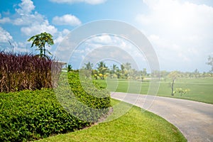 Concrete footpath with blue sky and white clouds