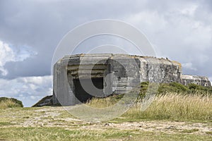 .Concrete fortification for a cannon off the coast of France, remnants of World War II