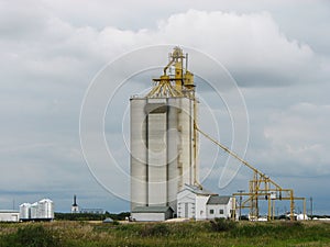 Concrete Grain Elevator with Cloudy Sky on Prairie