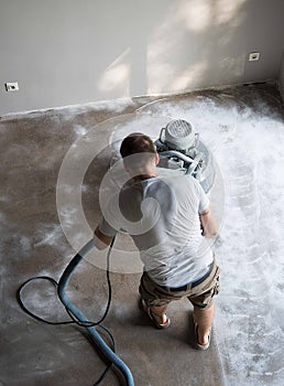 Concrete grinding in family home,construction works photo