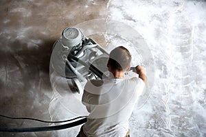 Concrete grinding in family home,construction works photo