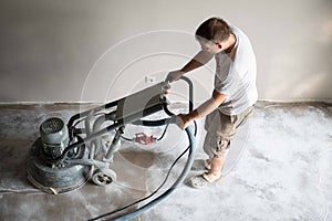 Concrete grinding in family home,construction works photo