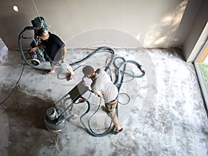 Concrete grinding in family home,construction works photo