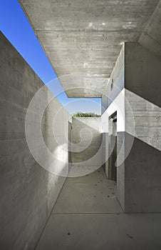 Concrete house underpass. Very strong cross shadow that gives character to the image