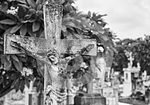 Concrete Jesus on cross at cemetery