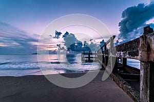 Concrete jetty along side to the sea