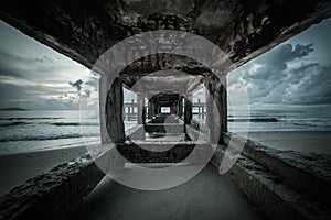 Concrete jetty along side to the sea