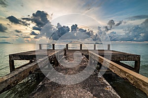 Concrete jetty along side to the sea