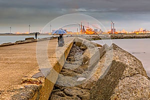 Concrete jetty near IJmuiden with anglers