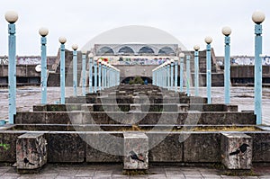 Concrete and lantern rows in abandoned monument of Soviet architecture