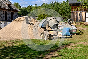 Construction site cement mixer machine, tools and sand