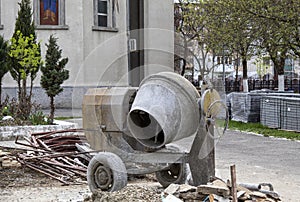 A concrete mixer on a construction site