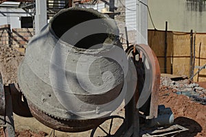 Concrete mixer, at construction site in zoom photo, color photo, equipment for civil construction