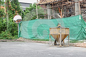 Concrete mixer container at construction site