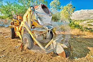 Concrete mixer with excavator