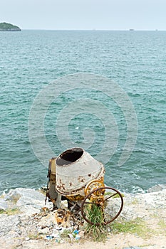 Concrete mixer at the seaside photo