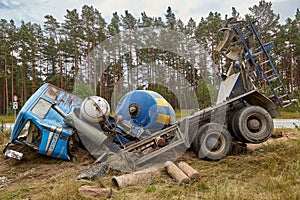 Concrete mixer truck involved in a car accident and driven off the road