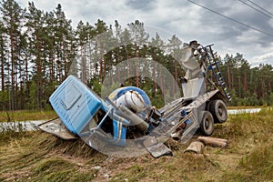 Concrete mixer truck involved in a car accident and driven off the road