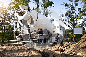 Concrete Mixer Truck Pouring Concrete on a Construction Site