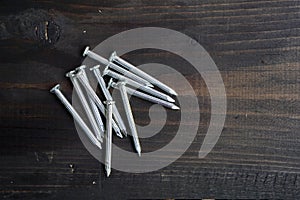 Concrete nails on a black wooden table