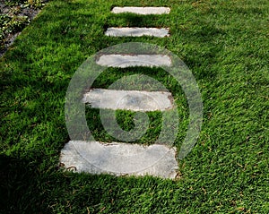 concrete path lawn pedal rectangular shape in regular grid routed directly