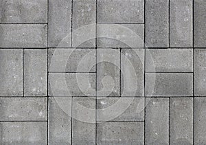 Concrete paving slabs are arranged in even squares