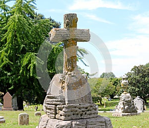 Concrete pillar with a Gothic cross on top