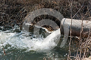 Concrete pipe transporting the poluted river