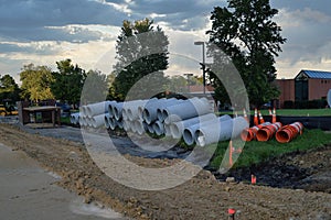 Concrete Pipes, Orange Barrels and Cones arranged neatly at a Construction Site in Innsbrook, VA
