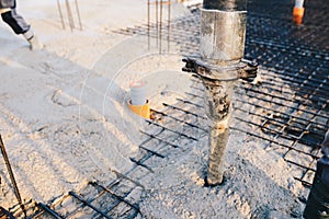 Concrete pouring during commercial concreting floors of building