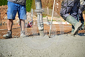 Concrete pouring during commercial concreting floors of building