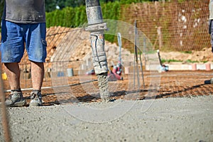 Concrete pouring during commercial concreting floors of building