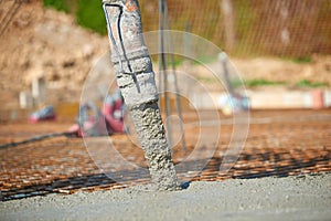 Concrete pouring during commercial concreting floors of building