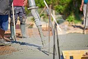 Concrete pouring during commercial concreting floors of building